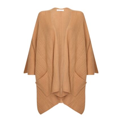 Womens Cashmere Cape with pockets, a soft cashmere cape made from 100% cashmere and detailed, functional pockets. Model wearing camel