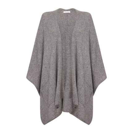 Womens Cashmere Cape with pockets, a soft cashmere cape made from 100% cashmere and detailed, functional pockets. Model wearing Grey