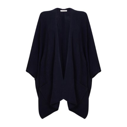 Womens Cashmere Cape with pockets, a soft cashmere cape made from 100% cashmere and detailed, functional pockets. Model wearing navy
