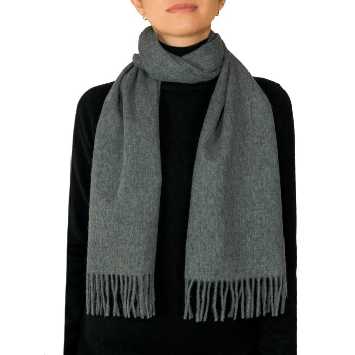Showcasing a smooth, solid colour, this 2-ply Lambswool scarf offers a clean, streamlined look with a gently textured surface, available in a range of elegant plain colours