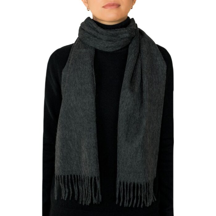 Showcasing a smooth, solid colour, this 2-ply Lambswool scarf offers a clean, streamlined look with a gently textured surface, available in a range of elegant plain colours