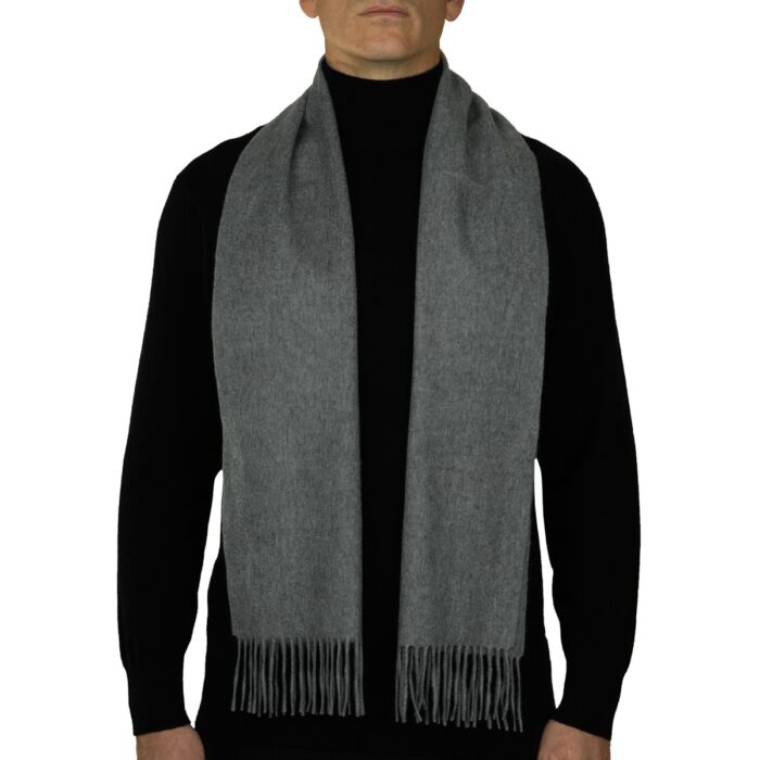 Showcasing a smooth, solid colour, this 2-ply Lambswool scarf offers a clean, streamlined look with a gently textured surface, available in a range of elegant plain colours