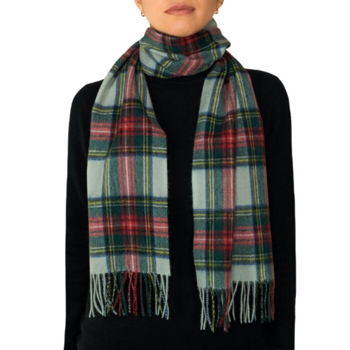 Featuring a rich tartan pattern, this 2-ply Lambswool scarf drapes gracefully with a classic check design and a subtle texture, available in a variety of traditional tartans