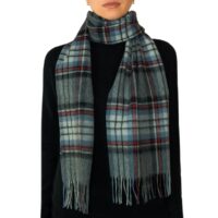 Featuring a rich tartan pattern, this 2-ply Lambswool scarf drapes gracefully with a classic check design and a subtle texture, available in a variety of traditional tartans