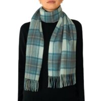 Featuring a rich tartan pattern, this 2-ply Lambswool scarf drapes gracefully with a classic check design and a subtle texture, available in a variety of traditional tartans