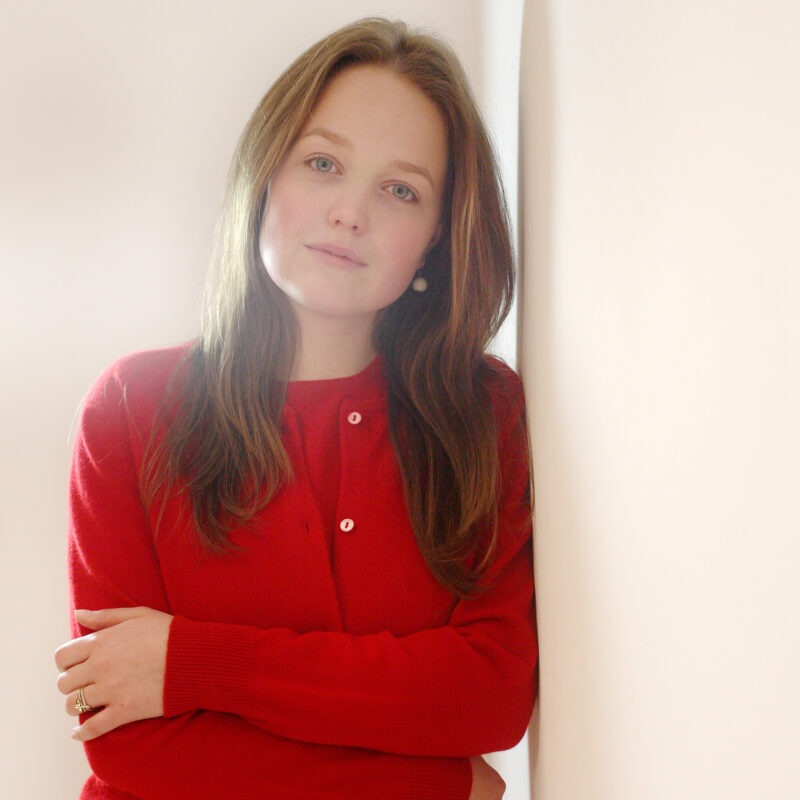 A Classic and stylish Womens Cashmere Cardigan in Red, matching short sleeve top available