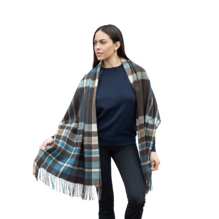 Model wearing Lona Scott Cashmere Shawl, in a patterned blue and brown