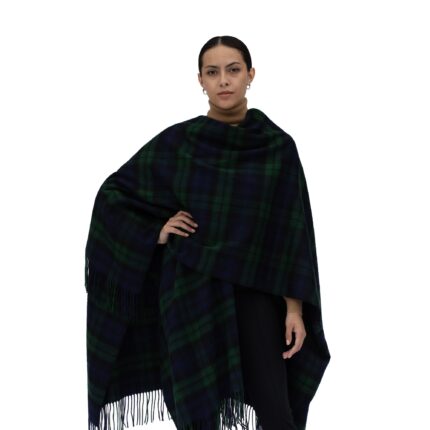 Model wearing Lona Scott Women's Lambswool Ruana Cape, a soft lambswool cape in Black Watch