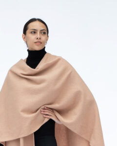 Model Wearing Lona Scott Lambswool Ruana Cape, a soft high-quality lambswool cape in Camel