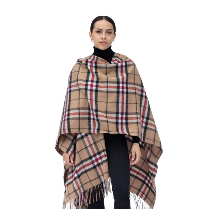Model wearing Lona Scott Women's Lambswool Ruana Cape, a soft lambswool cape in camel Thomson