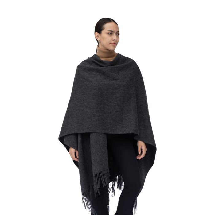 Model wearing Lona Scott Women's Lambswool Ruana Cape, a soft lambswool cape in Grey