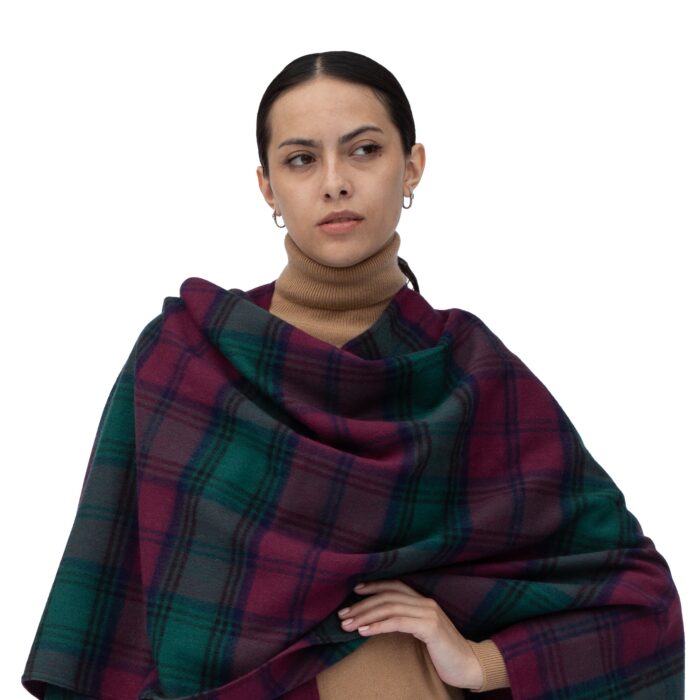 Model wearing Lona Scott Women's Lambswool Ruana Cape, a soft lambswool cape in Lindsay Tartan