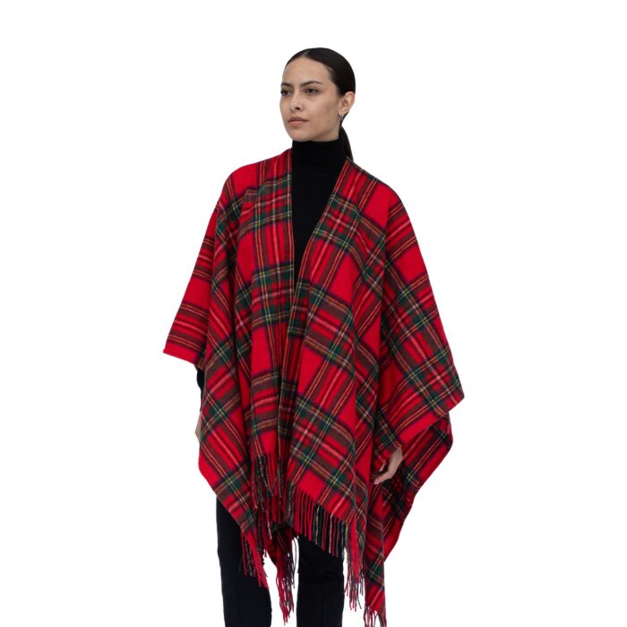 Model wearing Lona Scott Women's Lambswool Ruana Cape, a soft lambswool cape in Royal Stewart Tartan